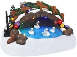 Christmas Village Tabletop Hockey Skating Rink - Pre-lit Winter Snow Village - Perfect Addition To Your Christmas Indoor Home Decorations - Great Centerpiece For Your Collection (Set Of 3 Figures) -Department 56 Shop 41QaXkoLK8L. AC