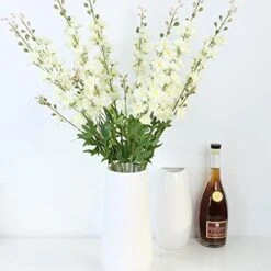 RIFNY 45 Packs Christmas Artificial Green Pine Needles 10 Inch Christmas Floral Picks Artificial Pine Branches For DIY Garland Wreath Crafts Christmas Tree Gift Wrap Home Garden Decoration -Department 56 Shop 41dXNKxNICL. AC