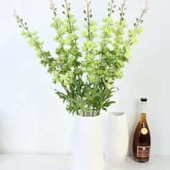 RIFNY 45 Packs Christmas Artificial Green Pine Needles 10 Inch Christmas Floral Picks Artificial Pine Branches For DIY Garland Wreath Crafts Christmas Tree Gift Wrap Home Garden Decoration -Department 56 Shop 519u6QBZGVL. AC