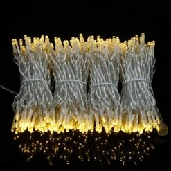 YULETIME 100 Feet 300 Count Warm White LED String Lights With 8 Models Adapter, 4" Spacing Plug-in Clear Wire Wide Angle 5mm Christmas Lights (Warm White - Multimode) -Department 56 Shop 51UCyh2eoiL