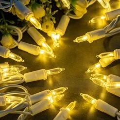 YULETIME Warm White LED Christmas Lights With White Wire, 66 Feet 200 Count UL Certified Commercial Grade LED Holiday String Light Set (Warm White - White Wire) -Department 56 Shop 51VbZKqtfPL