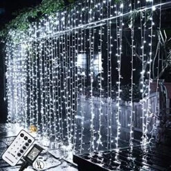 MAGGIFT 304 LED Curtain String Lights, 9.8 X 9.8 Ft, 8 Modes Plug In Fairy String Light With Remote Control, Christmas, Backdrop For Indoor Outdoor Bedroom Window Wedding Party Decoration, Warm White -Department 56 Shop 61JxgO3bhML. AC